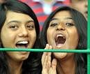 Excited: RCB fans cheering on during the match. DH Photo