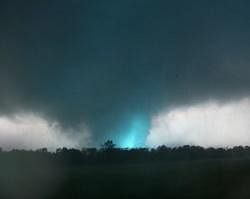 This frame grab from video shows lightning inside a massive tornado on Sunday, May 22, 2011, outside Joplin, Mo.  The tornado tore a 6-mile path across southwestern Missouri killing at least 89 people as it slammed into the city of Joplin, ripping into a hospital, crushing cars like soda cans and leaving a forest of splintered tree trunks behind where entire neighborhoods once stood.  AP Photo