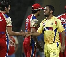 Chennai Super Kings captain M S Dhoni being greeted on by RCB on winning the IPL 4 match by 6 wickets in Mumbai on Tuesday PTI Photo
