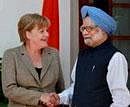 Prime Minister Manmohan Singh shakes hands with German Chancellor Angela Merkel before a meeting at Hyderabad House in New Delhi on Tuesday. PTI Photo