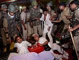 Police evicting supporters of Baba Ramdev from Ramlila Ground in New Delhi on Saturday night. PTI