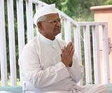 Social activist Anna Hazare sits on one-day fast to protest against police crackdown on Baba Ramdev and his supporters, at Rajghat in New Delhi on Wednesday. PTI