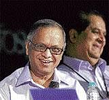 Infosys Chairman N R Narayana Murthy with his successor K V Kamath during the company's 30th annual general meeting (AGM) in Bangalore on Saturday. PTI