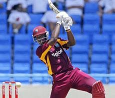 West Indies' Andre Russell plays a shot during the third one-day international cricket match against India in St. John's, Antigua, on Saturday. AP