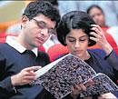 Outgoing Infosys Chairman N R Narayana Murthys son Rohan Murthy with wife Lakshmi at the companys 30th annual general body meeting in Bangalore on Saturday. PTI