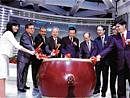 Executives of Integrated Memory Logic bang the drum at the Taiwan Stock Exchange in an undated handout photo. NYT