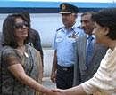 In this handout photograph released by Ministry of External Affairs (MEA) on June 23, 2011, Indian Foreign Secretary Nirupama Rao (C) is greeted by Pakistan government officials as she arrives at Chaklala Air Base in Islamabad. AFP