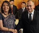 Pakistani Foreign Secretary Salman Bashir, right, shakes the hand of Indian counterpart Nirupama Rao, left,  prior to their talks at The Pakistan Foreign Ministry in Islamabad on Friday . AP