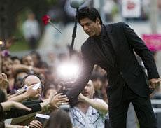 Shahrukh Khan greets fans on the green carpet at the 2011 International Indian Film Academy Awards, Saturday in Toronto. AP
