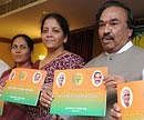 Ms. Shobha , Energy minister ; Ms Nirmala Sitharaman , BJP national Spokesperson ;   K S Eshwarappa , state BJP president  jointly releasing chargesheet booklet against H D Kumaraswamy former J D [s] Chief minister during the  press conference in bangalore on tuesday. DH Photo