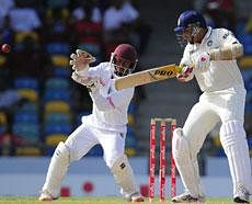 VVS Laxman plays a shot in front of West Indies wicketkeeper Carlton Baugh to be caught and dismissed by Adrian Barath during the first day of the second test match between West Indies and India at Kensington Oval in Georgetown, Barbados, June 28, 2011. AFP