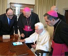 Pope Benedict XVI touches a touchpad to send a tweet for the launch of the Vatican news information portal "www.news.va", at the Vatican. AP