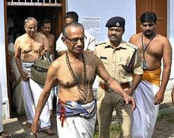 Members of an expert group coming out of Sree Pathmanabhaswami temple after taking stock of the unearthed valuables kept in the store room of the temple in Thiruvananthapuram on Saturday. PTI