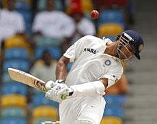 India's Rahul Dravid moves away from a ball bowled by West Indies' Darren Sammy during the fourth day of the second cricket Test match in Bridgetown - AP Photo