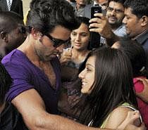 Bollywood actor Hrithik Roshan interacts with a fan during a promotional event for his film "Zindagi Na Milegi Dobara" in Ahmedabad on Friday. PTI Photo