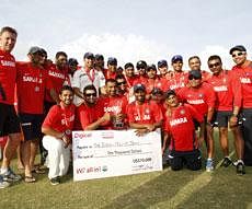 India's cricket team poses with their trophy and check after winning their three match series against the West Indies 1-0 on the fifth day of the third cricket Test match in Roseau, Dominica on Sunday. AP Photo