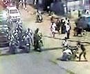 A CCTV&#8200;grab shows the assailants attacking the victim while pedestrians and motorists watch silently in Coimbatore on Wednesday.