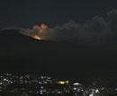 The glow of lava from Mount Lokon's eruption is seen against the night sky as seen from Manado, North Sulawesi, Indonesia, early Friday. AP Photo