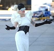 US pop star Lady Gaga gestures after steping off her private jet at Sydney Airport. AFP Photo