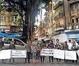 United Against Terror: Youths in Mumbai hold placards as they form a human chain during a rally to protest against the bomb blasts, on Saturday. AFP