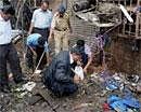 Forensic experts investigating near the Opera House blast site in Mumbai on Friday . PTI