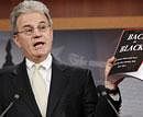 Sen. Tom Coburn, R-Okla. reveals his "Back in Black" plan to reduce the federal deficit,. AP