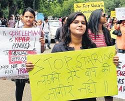 Participants hold placards during the Besharmi Morcha march or Slutwalk in New Delhi on Sunday. PTI