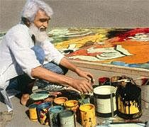 M.F. Husain (in his heydays) at work on his canvas at Celebrating Husain. IANS Photo