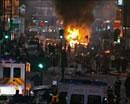In this image from video, a bus and shop burn in Tottenham, north London late Saturday Aug 6 2011 after two police cars were attacked by members of a community where a young man was shot dead by police on Thursday. Several hundred people took to the streets to demand "justice". AP Photo