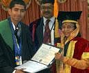President Pratibha Patil presents an award to Gautham who secured 16 gold medals in the XIX Annual Convocation of National Law School of India University Bangalore, on Sunday. PTI