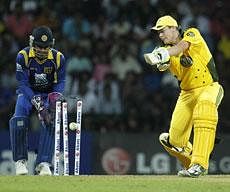 Australia's batsman Steve Smith is bowled out as Sri Lankan wicket keeper Kumar Sangakkara looks on during the second Twenty20 cricket match between Sri Lanka and Australia in Pallekele, Sri Lanka. AP PHOTO