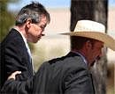 Warren Jeffs, leader of the Fundamentalist Church of Jesus Christ of Latter Day Saints, left, is led out of the Tom Green County Courthouse in San Angelo, Texas on Tuesday. AP
