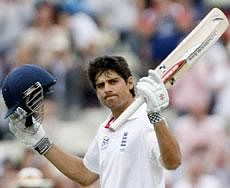 England's Alastair Cook raises his bat after scoring a century against India on the second day of the third test match at the Edgbaston Cricket Ground, Birmingham, England. AP Photo