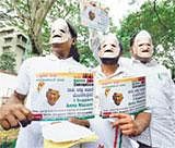 No Charade:Members of India Anti-CorruptionMovement wearing Anna Hazare masks demonstrate in support of the Jan Lokpal bill, in Bangalore on Friday. PTI