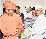 Activist Anna Hazare along with Kiran Bedi and Swami Agnivesh at a press conference in New Delhi on Saturday. PTI