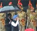 rime Minister Manmohan Singh inspects a guard of honour before addressing the nation from the Red Fort during 65th Independence Day function in New Delhi on Monday. PTI