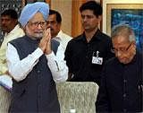 Prime Minister Manmohan Singh arrives to attend an all-party meeting on Lokpal Bill at PM House in New Delhi on Wednesday.(R) Union Ministers Pranab Mukherjee is also seen PTI Photo