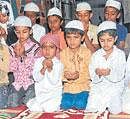 Devotion: Children offer prayers at an Iftar party organised in&#8200;Mysore. Kids exchanged pleasantries and were given a grand supper.  DH Photo by Prashanth H G