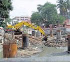 The NICE has alleged that the pillars BBMP constructed for its flyover from West of Chord Road to Mysore Road is responsible for the flooding of Gali Anjaneyaswamy Temple. DH Photo