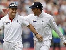 England captain Andrew Strauss, left and spinner Graeme Swann celebrate after beating India in the third test match at the Edgbaston Cricket Ground, Birmingham, England on August 13, 2011 . AP File Photo