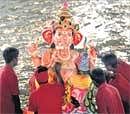Inconvenient Large processions to immerse idols of Lord Ganesha hold up traffic on the roads.