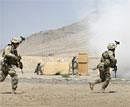 Afghan special forces run as they demonstrate their learned skills at the Kabul Military Training Center in Kabul, Afghanistan, Tuesday, AP