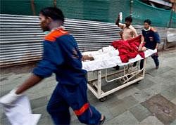 Medical attendants rush a wounded blast victim to the trauma centre at the RML Hospital in New Delhi on Wednesday. AFP