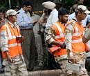 National Investigation Agency (NIA) team investigating the blast site at the High Court in New Delhi on Wednesday. PTI