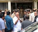 Former Chief Minister B S Yeddyurappa greets the people as he arrives at City Civil Court Complex to appear before the Lokayukta Special Court for a case hearing against him and his family, in Bangalore on Wednesday. DH File Photo