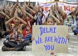 Schoolchildren offer prayers for victims of Wednesday's blast outside a courthouse in New Delhi, at a school in Ahmadabad. AP