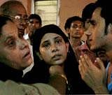 : Mumtaz (L), daughter of Nizamuddin who died in the bomb blast at Delhi High Court, waits outside the Casualty Ward of RML hospital in New Delhi on Wednesday. PTI Photo