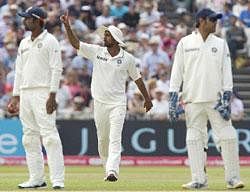 India's Praveen Kumar, centre, appeals for the wicket of England's Ian Bell controversially given out after walking from the pitch for tea after mistakenly believing a ball had gone for four on the third day of their cricket test match at Trent Bridge cricket ground. AP