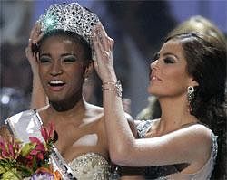 Miss Angola Leila Lopes, left, is crowned Miss Universe 2011 by Miss Universe 2010 Ximena Navarrete, of Mexico, in Sao Paulo, Brazil, Monday Sept. 12, 2011. (AP Photo)