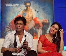 Bollywood actors Shahrukh Khan, and Kareena Kapoor take part in a music launch ceremony for the upcoming Hindi science-fiction superhero film ''Ra One'' directed by Anubhav Sinha in Mumbai on September 12, 2011. AFP